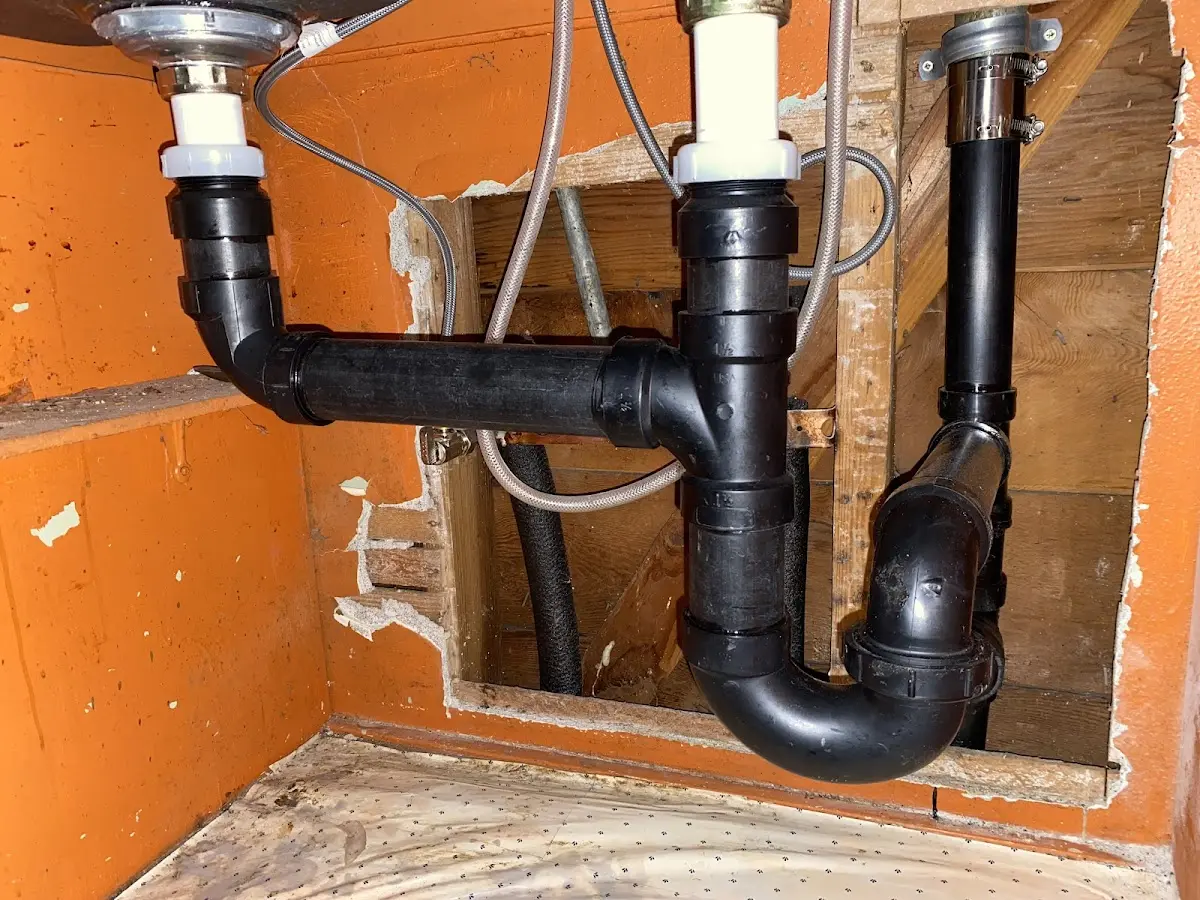 Professional Garbage Disposal Repair equipment and tools on the job in Oradell